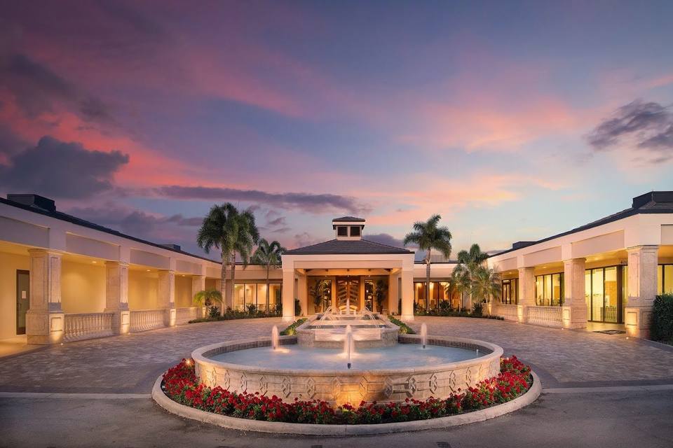 Del Webb Naples Oasis Club with resort pool and palm trees in Ave Maria